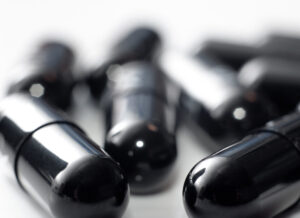 close up of black pill capsules - black beauty drug black beauties pills