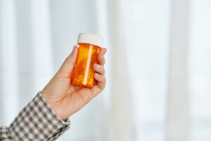 person holding bottle of m367 pills - m367 pill